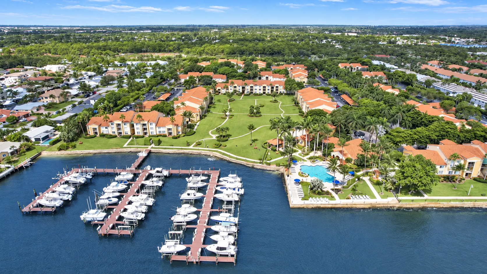 Aerial view of the Yacht Club marina, pool and waterfront residences